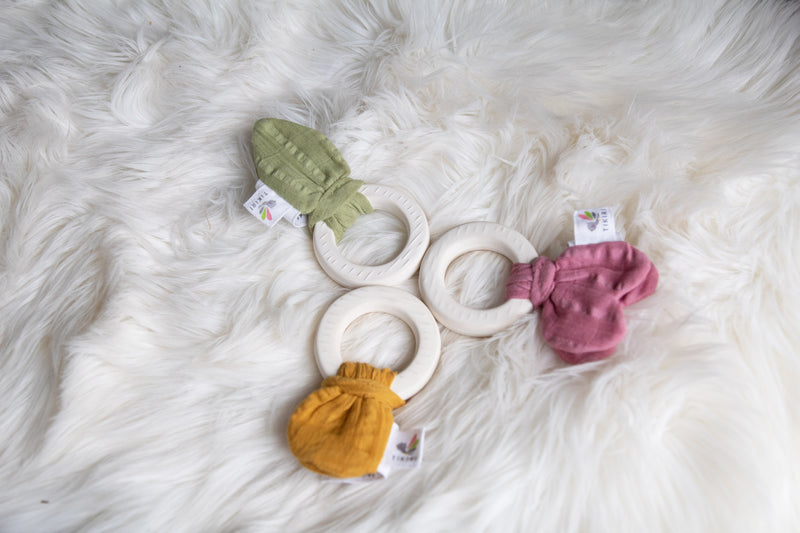 Natural Rubber Teether with a Sage Green Muslin Tie